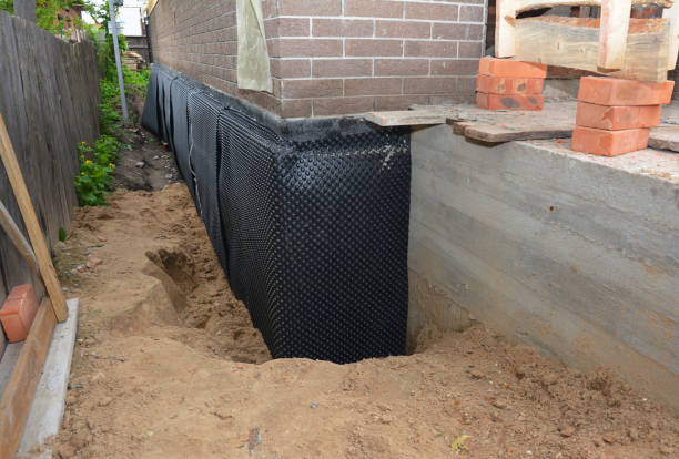 SJ Waterproofing Pros technician performing targeted Basement Waterproofing assessment in Lowell, NC